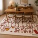 Abstract Faces Wool Rug – Hand-Tufted Terracotta & Cream Modern Art Area Rug